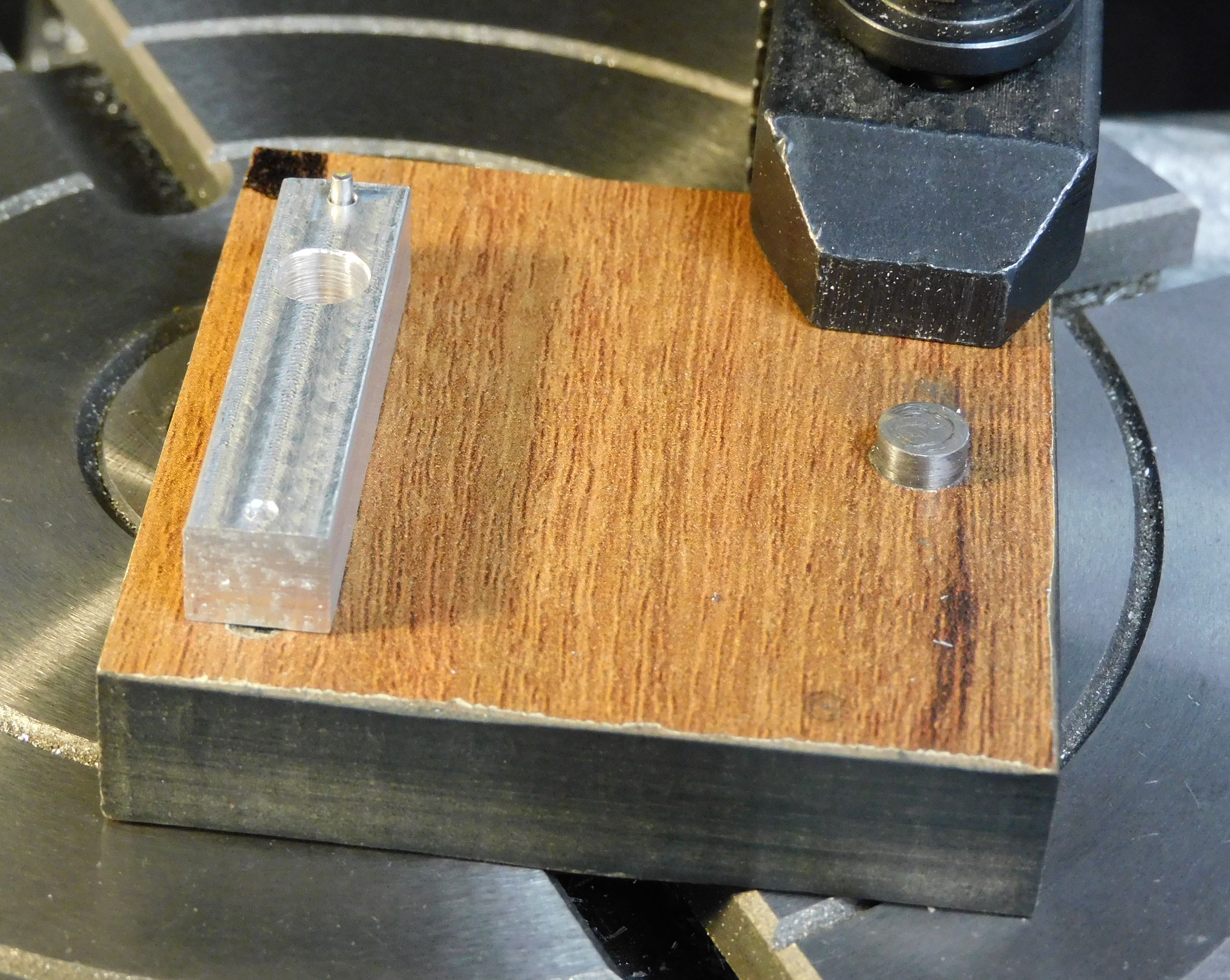 Arm mounted on jig B for milling