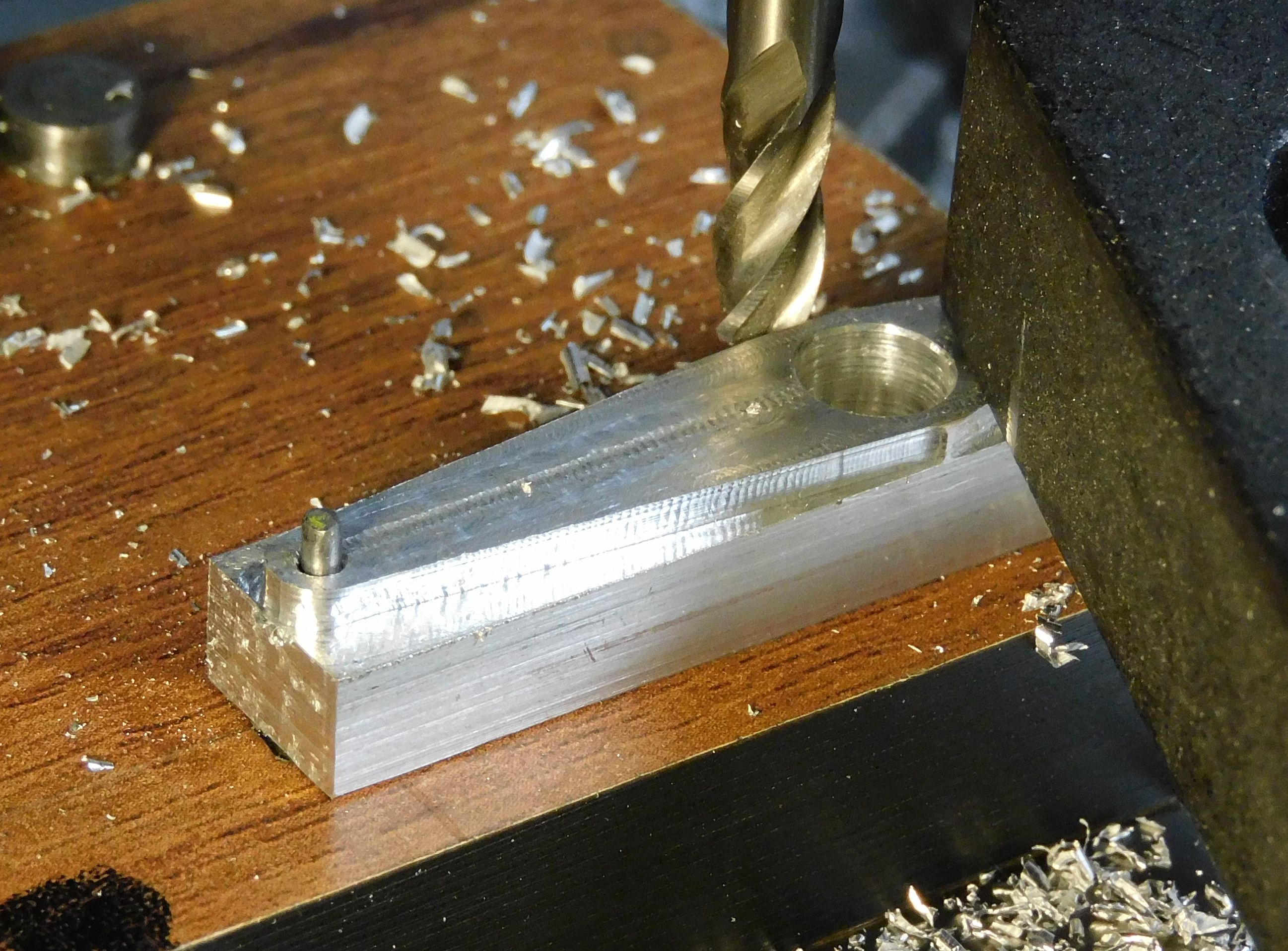 long end of arm being milled to shape