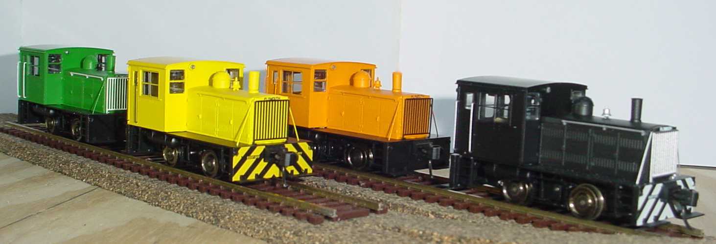 Four colored trains/locos