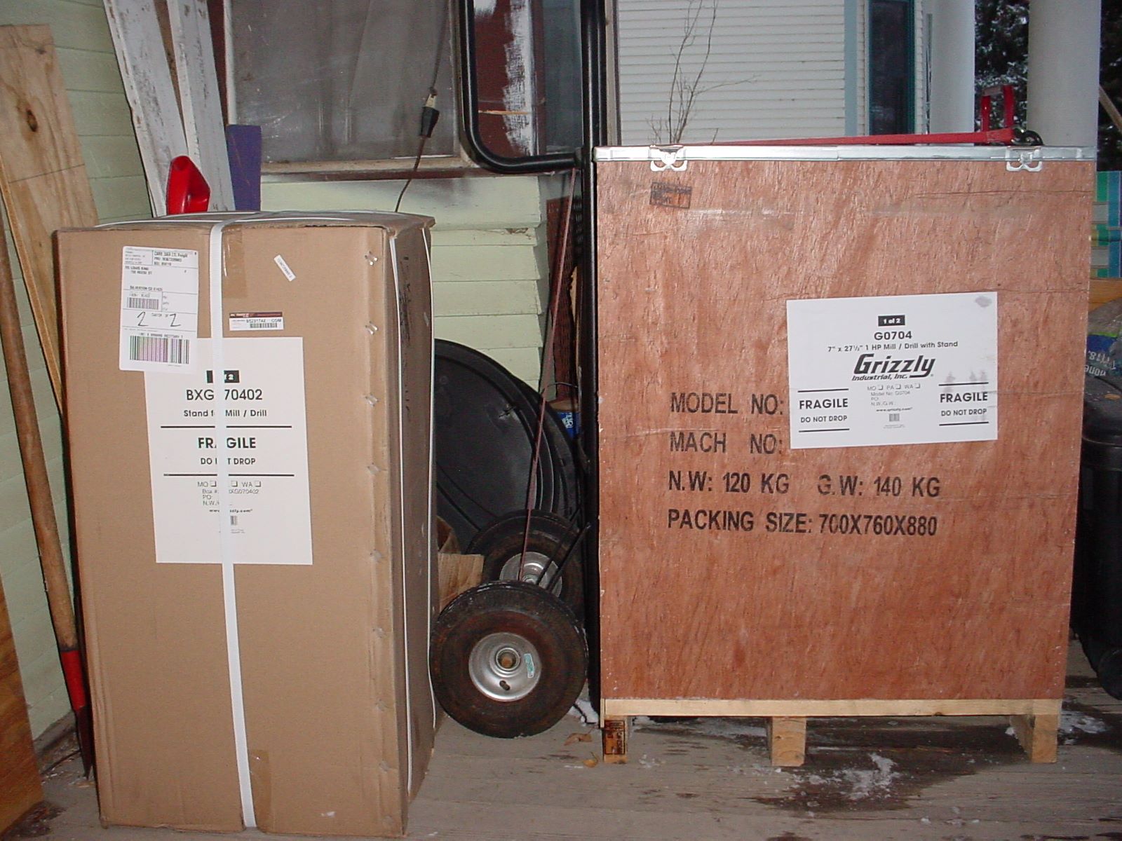 Vertical Mill on the porch in crates