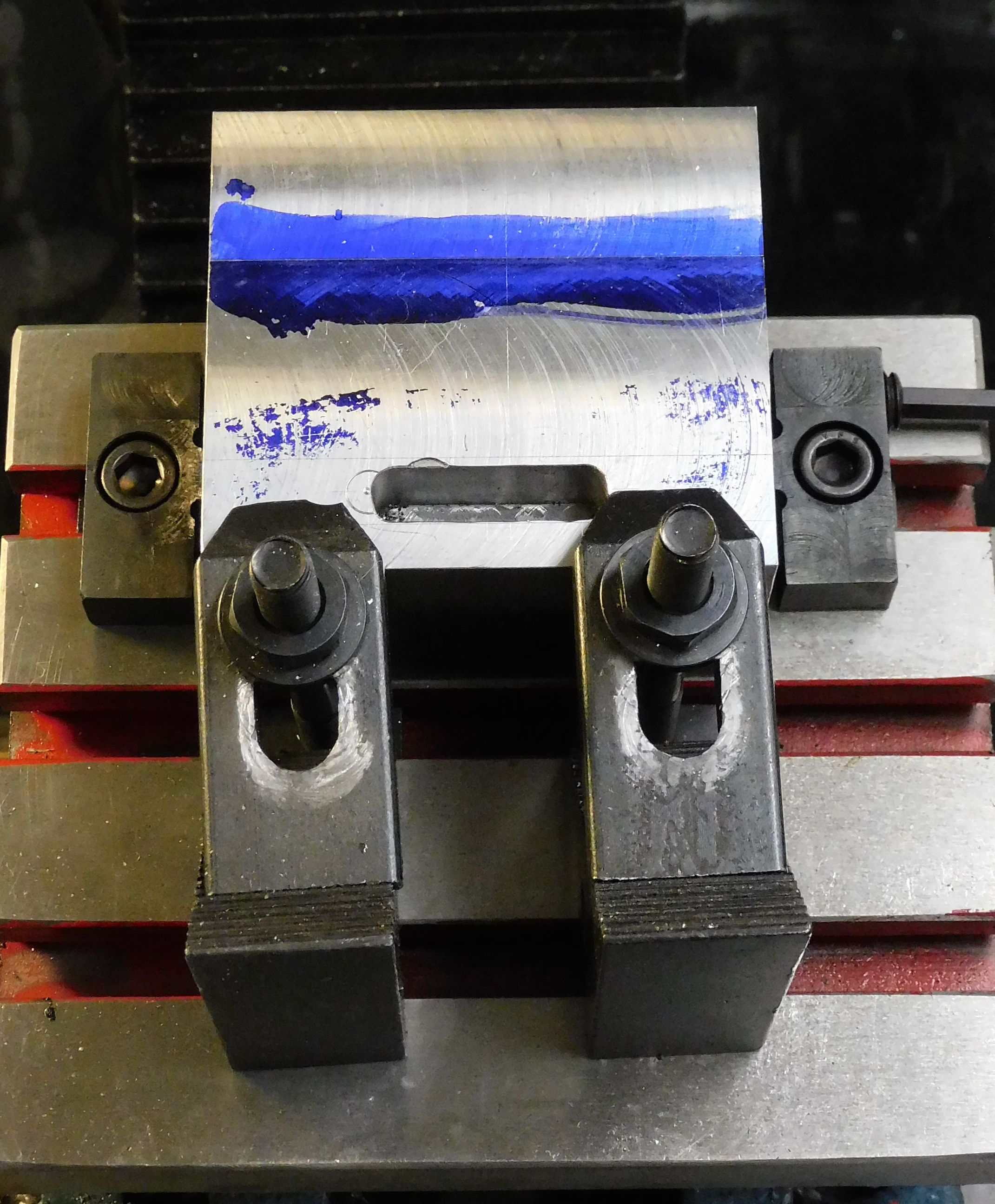 Front view of jig being held by side clamps