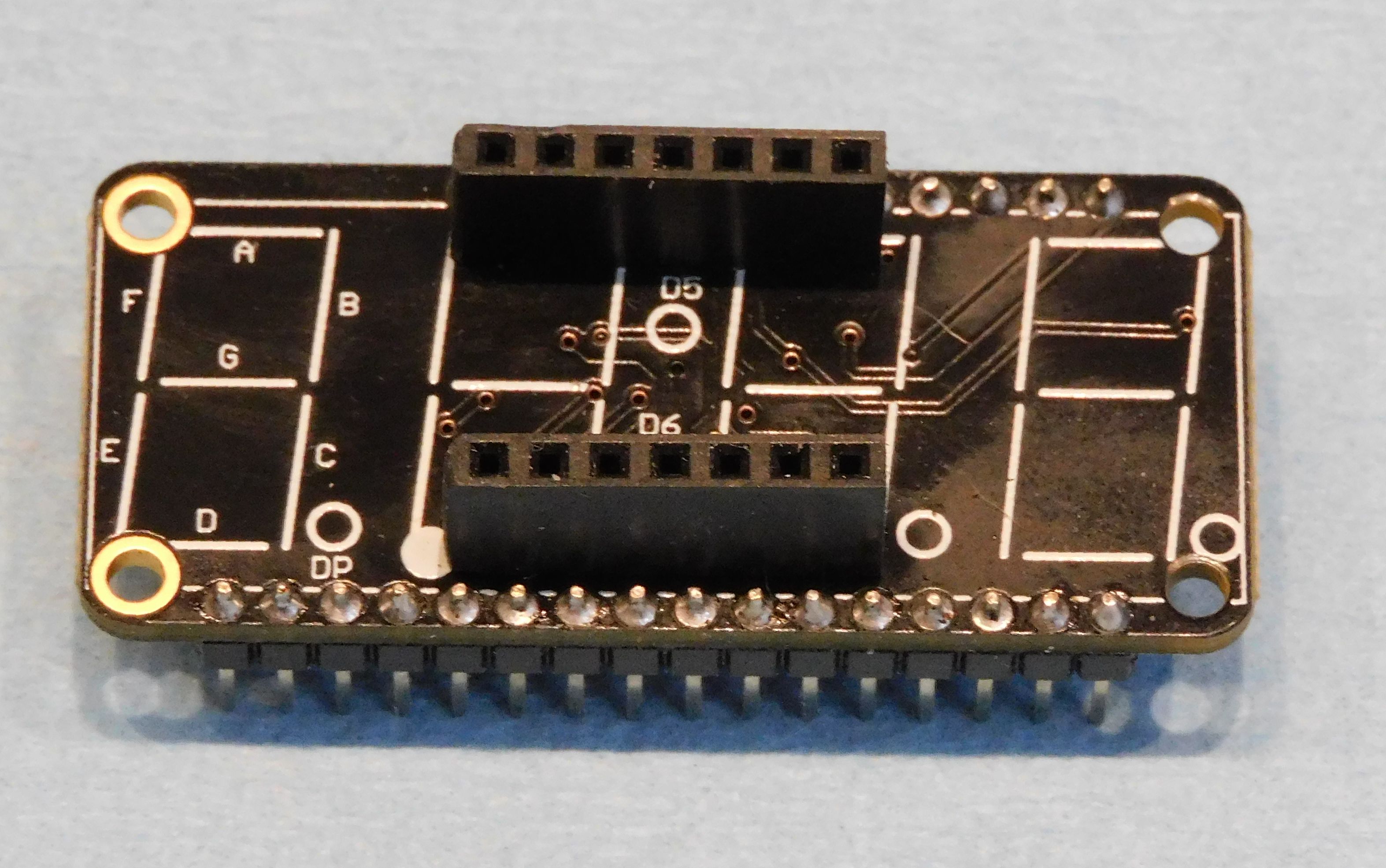 quad 7-segment LED FeatherWing with plugs inplace of the LED
